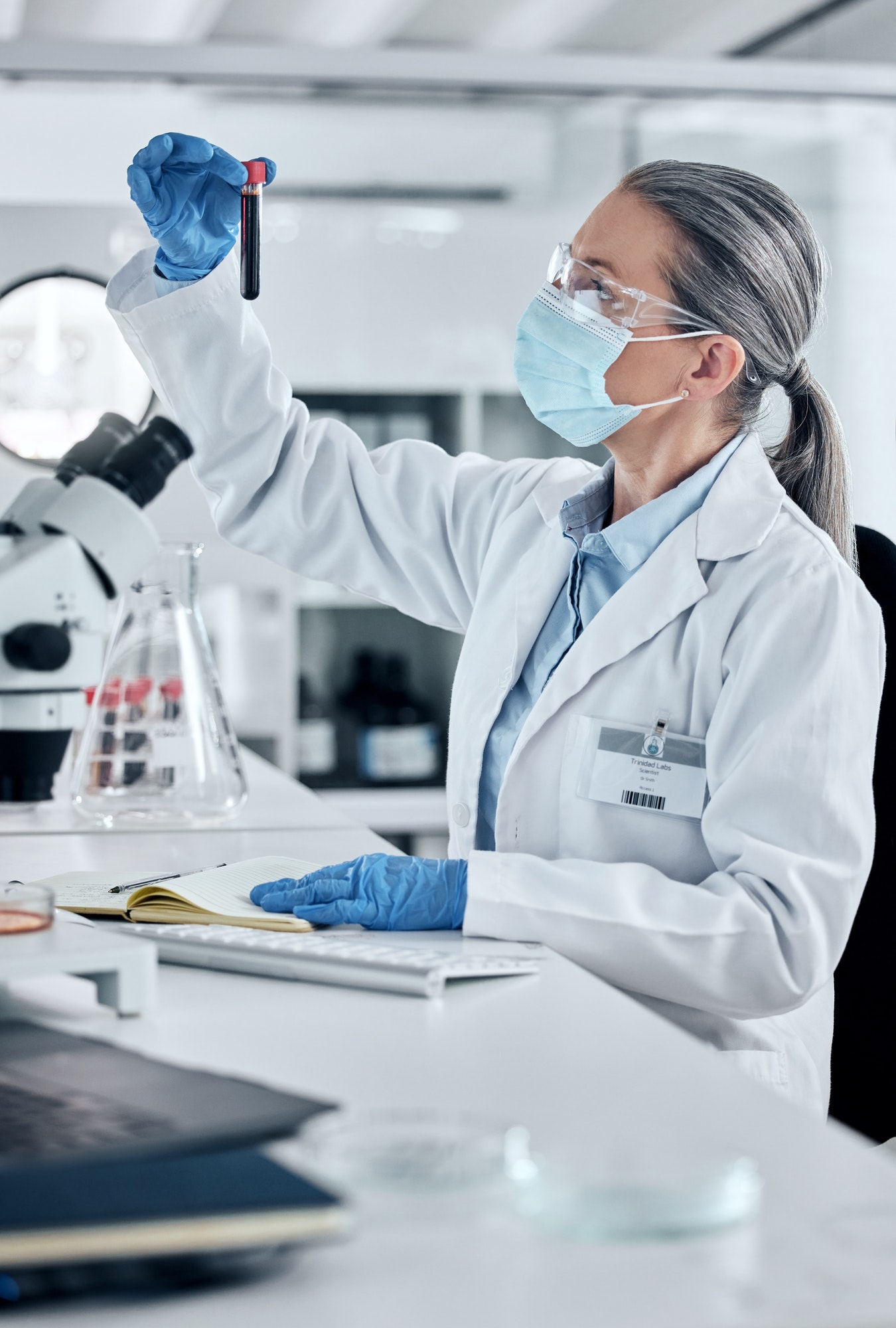 Scientist, pathology and blood or DNA science woman working in a lab for covid research, innovation